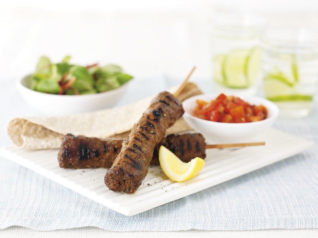 Kebabs with unleavened bread and salad