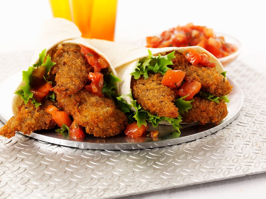Breaded chicken fillets and tomato salsa wraps