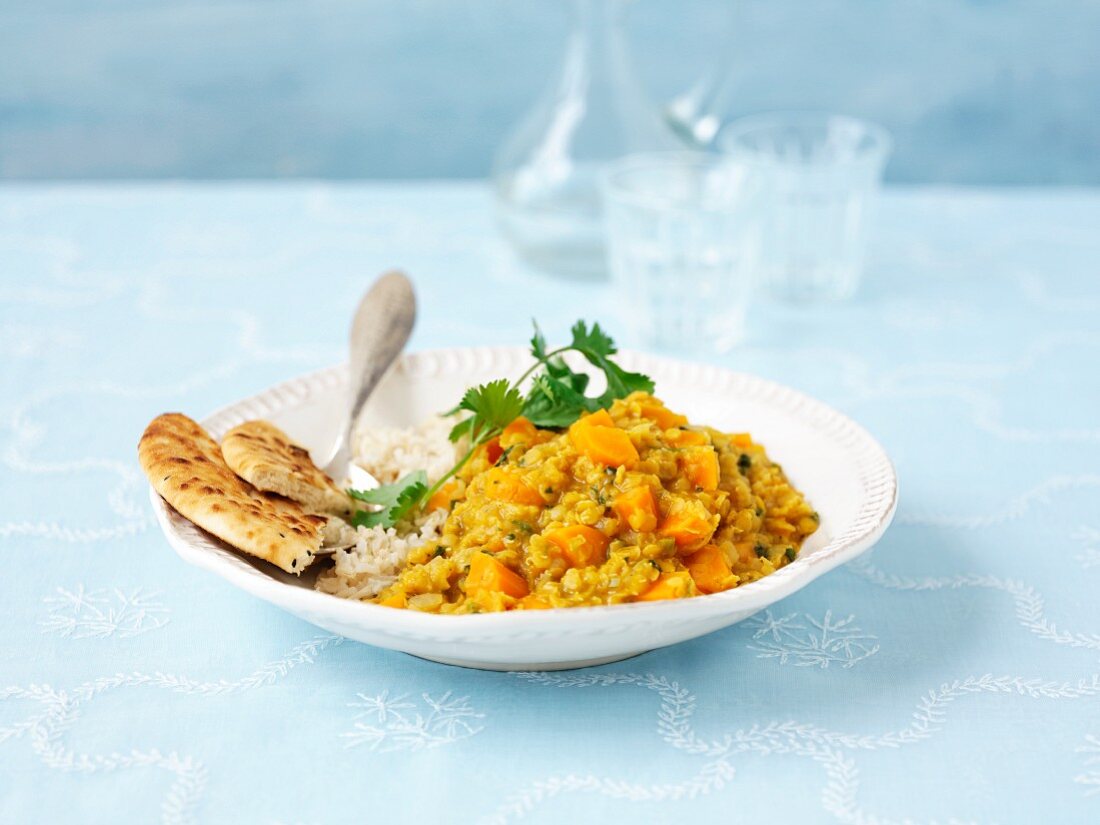 Vegetable curry with rice and unleavened bread