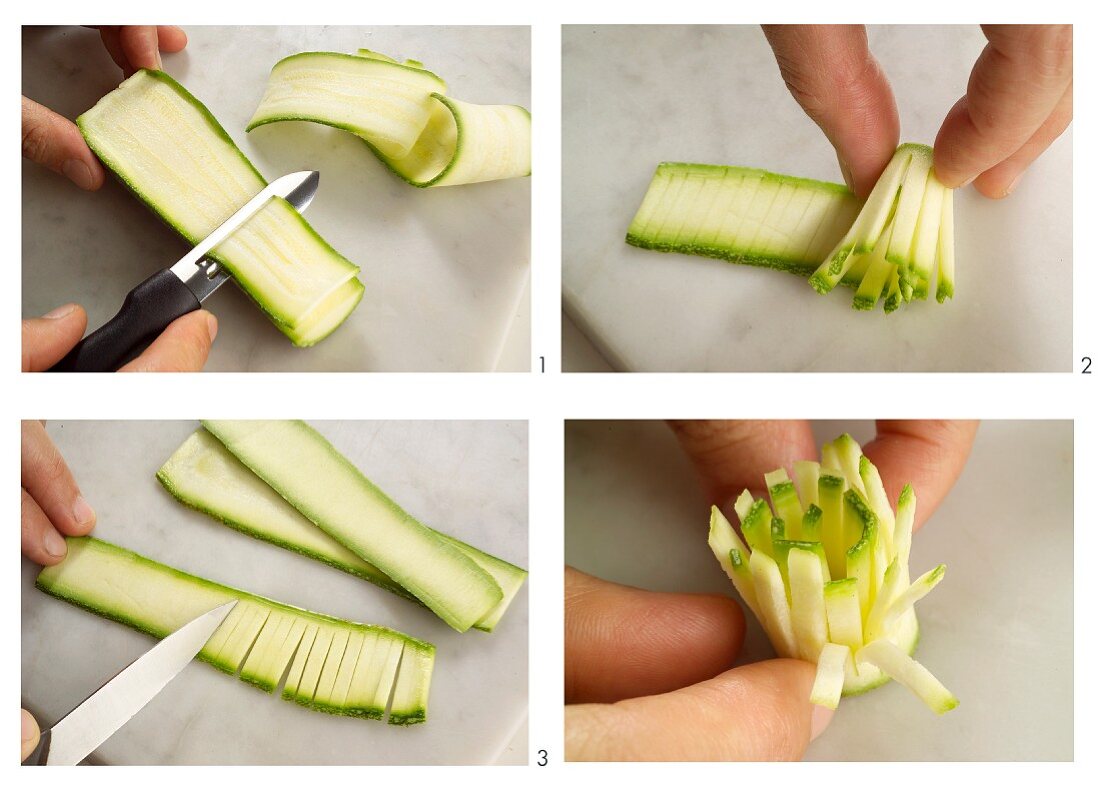 A courgette being cut into a flower