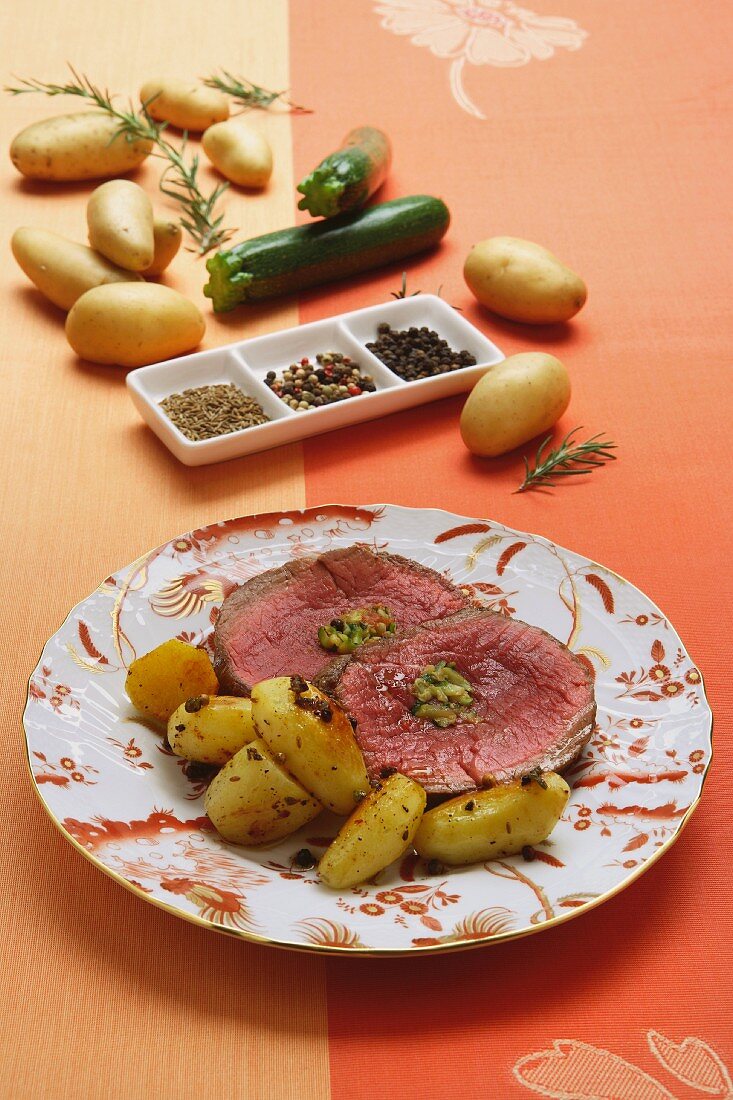 Beef fillet filled with courgettes and served with potatoes
