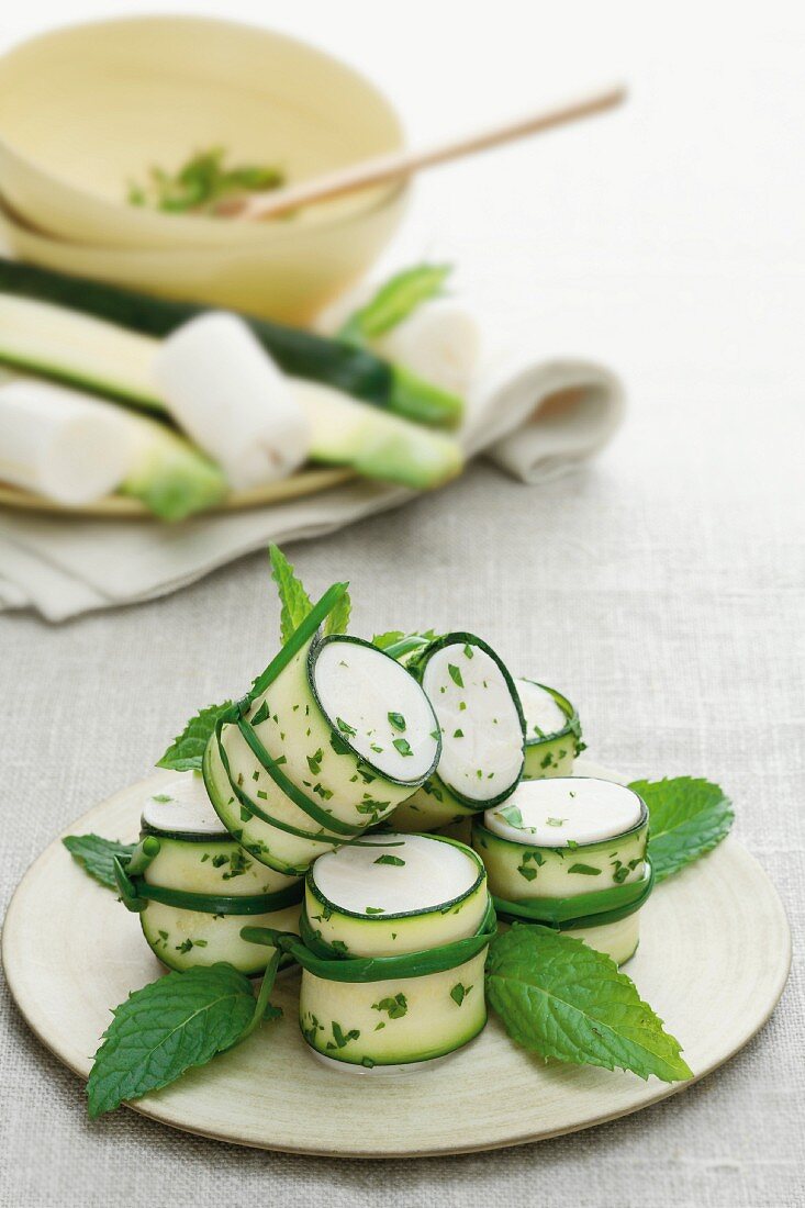 Cucumber rolls with cream cheese and mint
