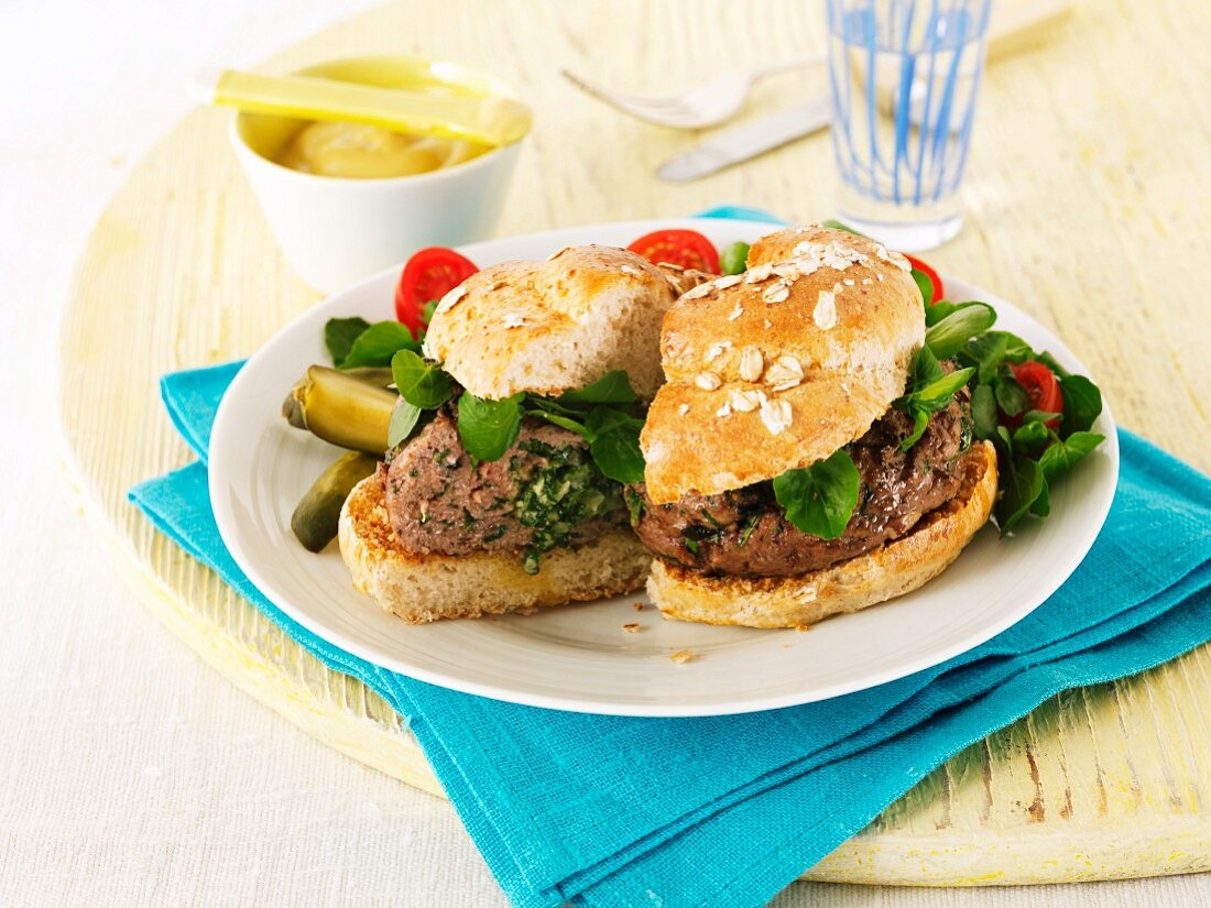 Hamburgers with lettuce, mustard and gherkins