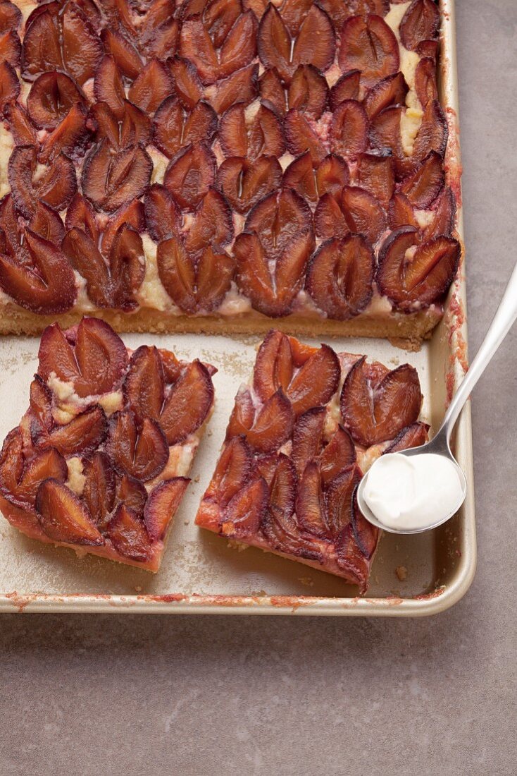 Plum cake on a baking tray