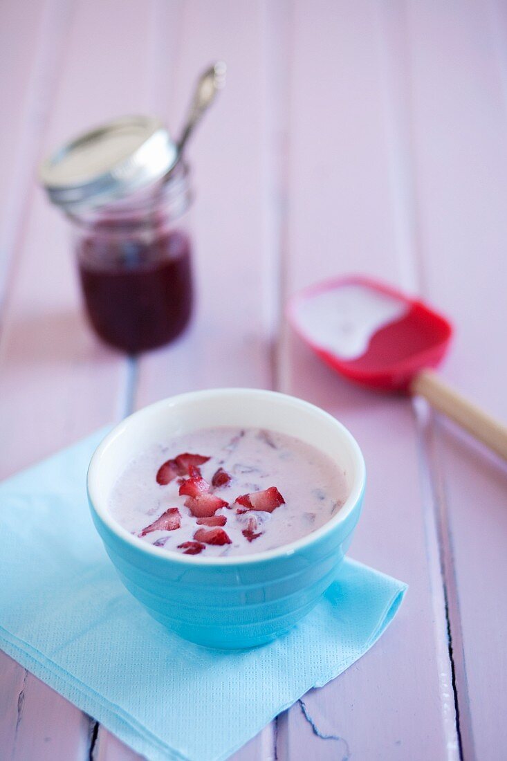 Bowl of Yogurt and Strawberries in a Blue Bowl