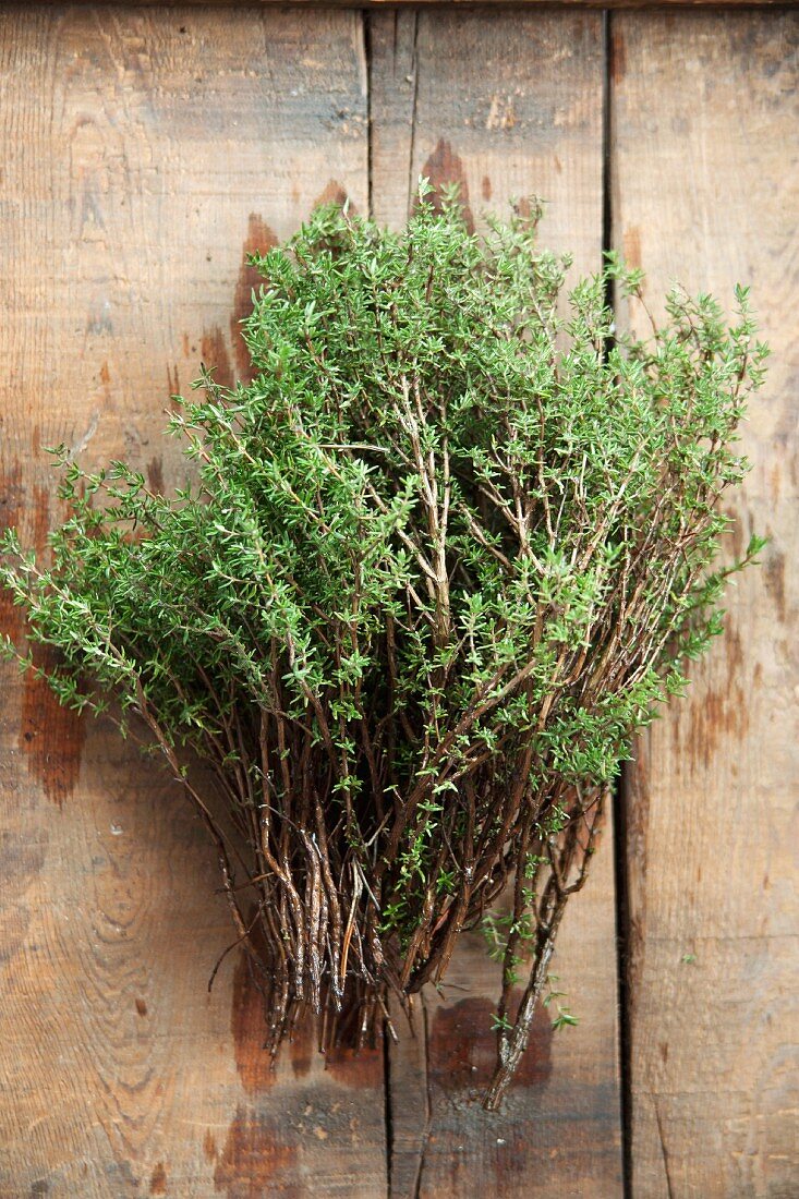Fresh thyme on a wooden table