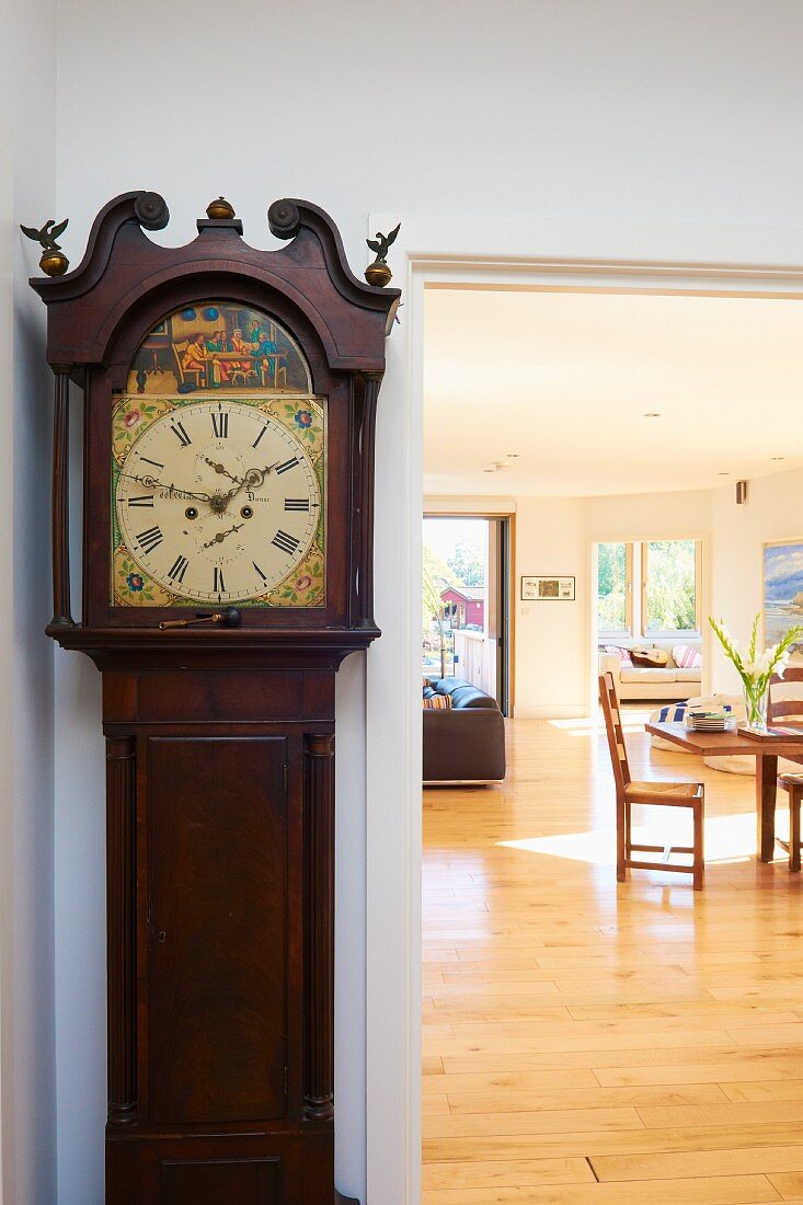 Antique grandfather clock in spacious, sunny interior