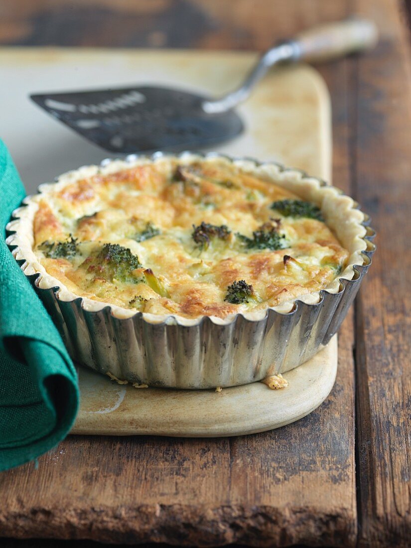 Broccoli and Cheese Mini Quiche on a Wooden Table