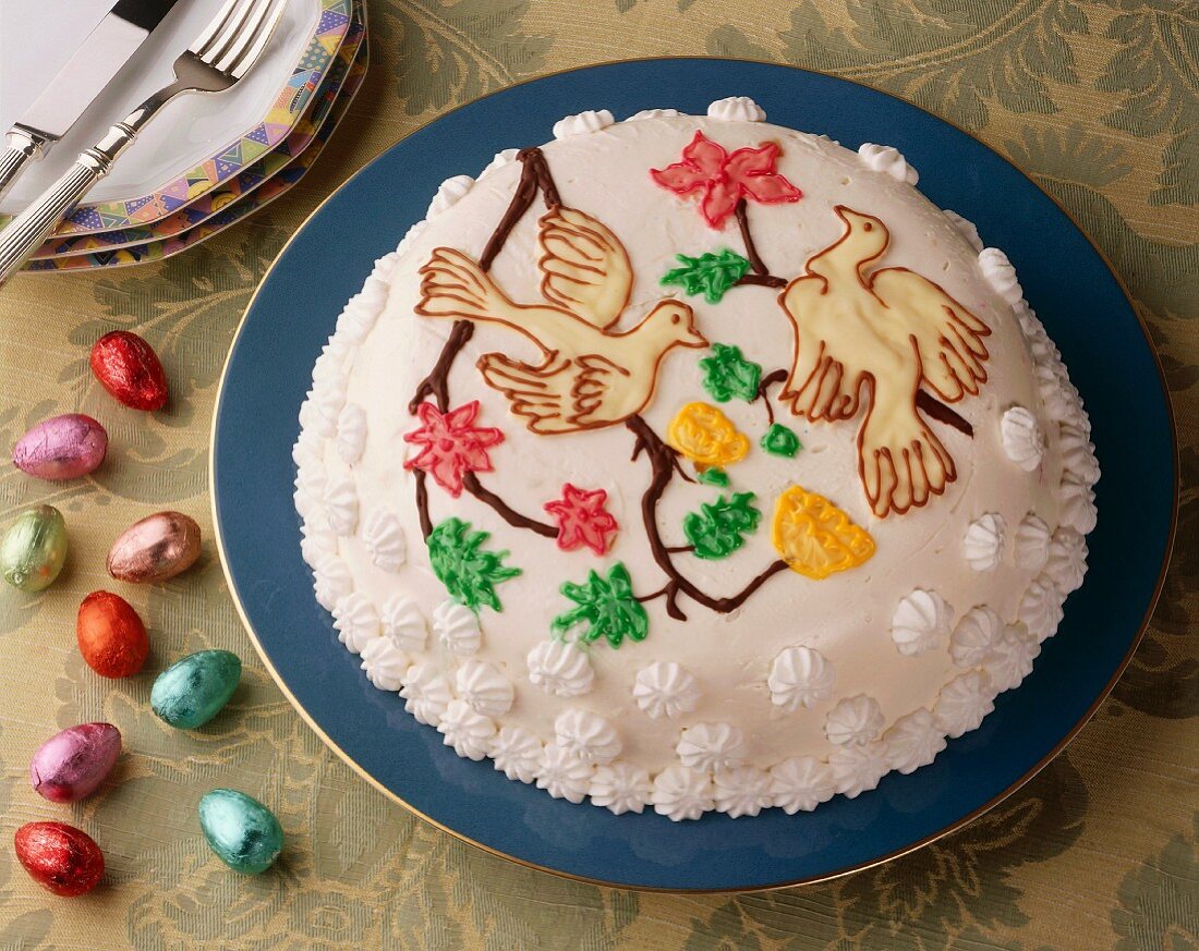 A dome cake decorated with doves for Easter