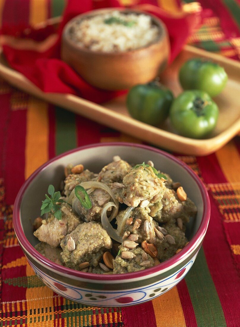 Pork with tomatillo sauce, peanut and sunflower seeds (Mexico)
