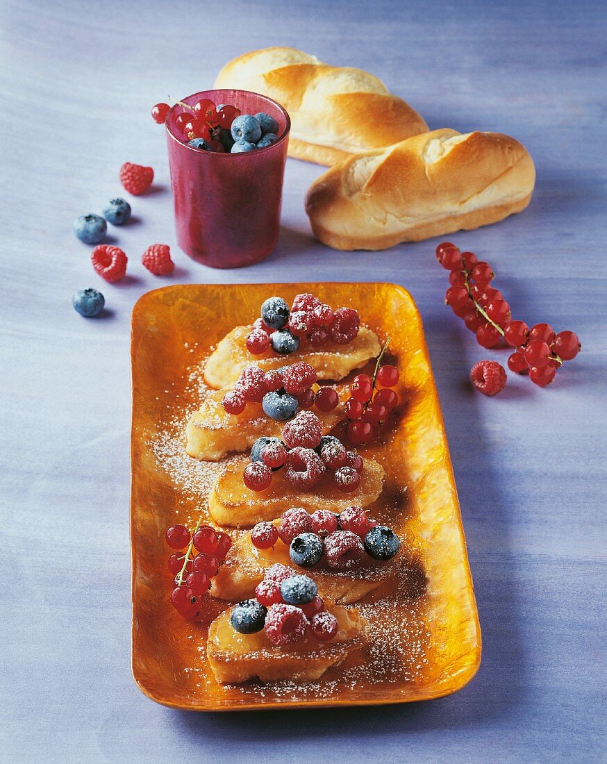 Sweet crostini topped with jam and berries