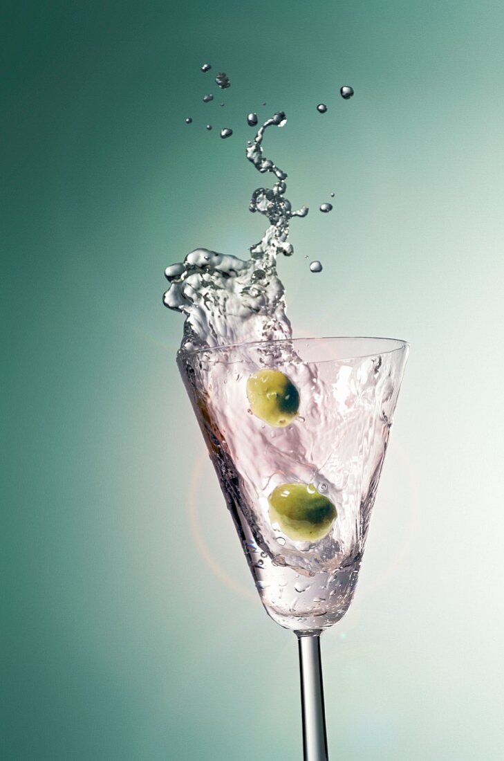 Martini splashing out of a glass