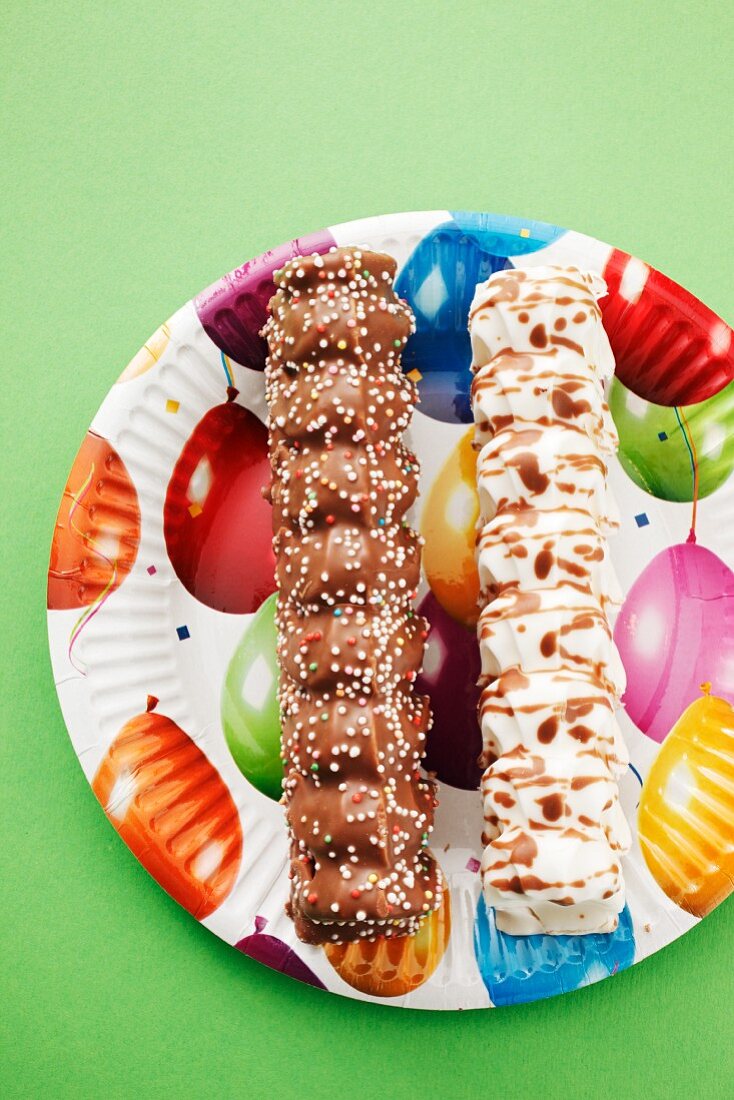 Marshmallow kebabs on a colourful paper plate