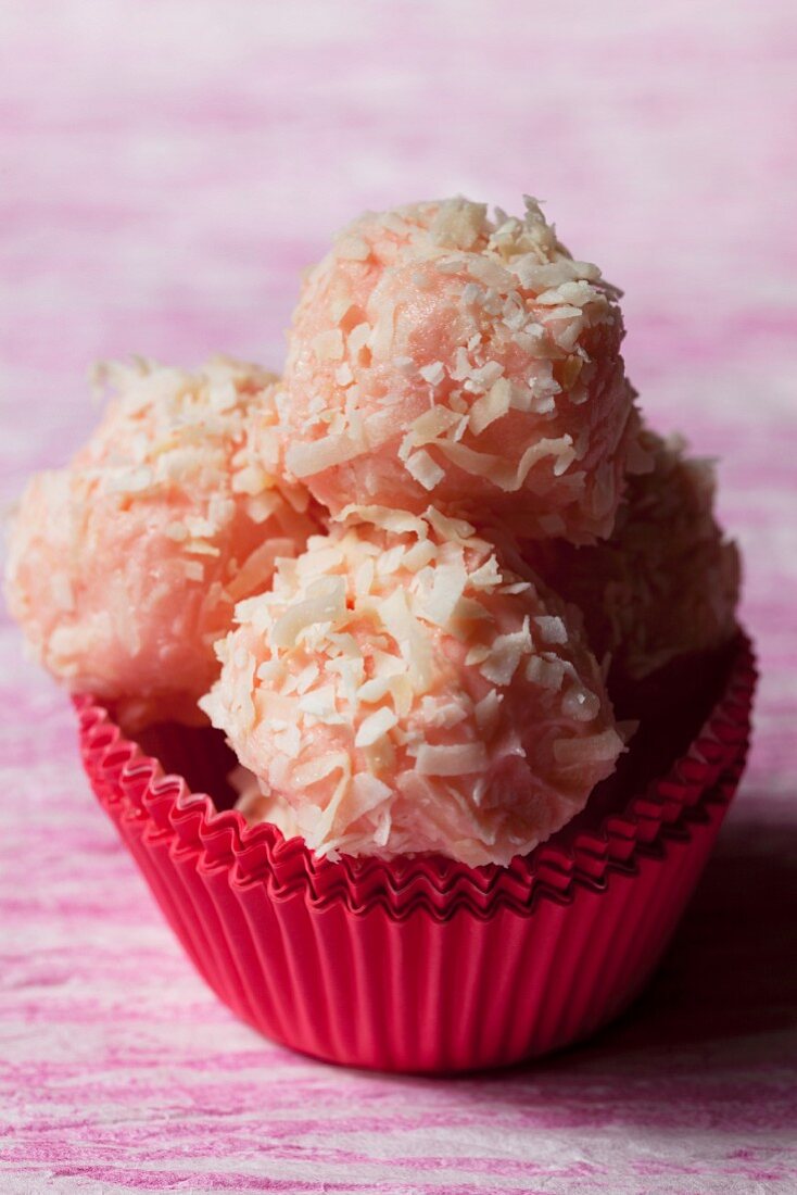 Pink truffle pralines with dessicated coconut