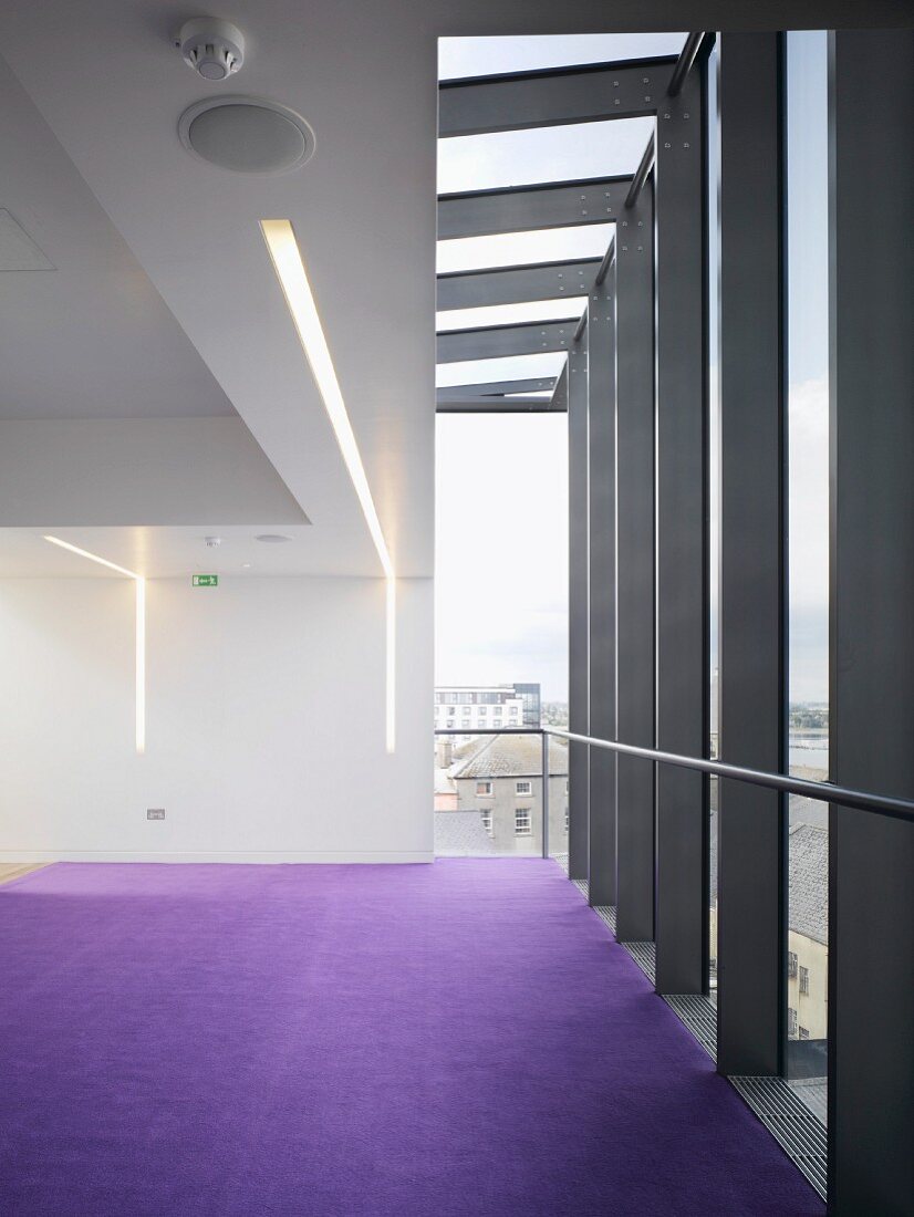 Empty room with purple carpet in contemporary building