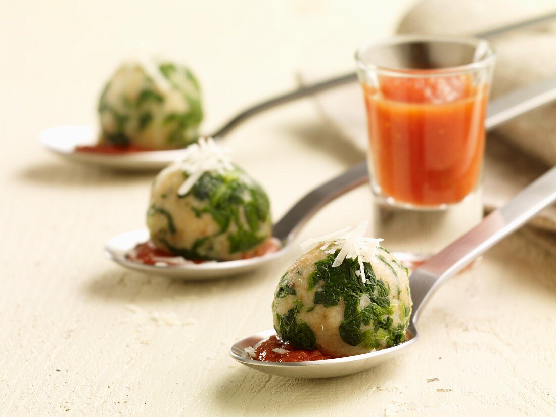 Spinach dumplings with tomato sauce
