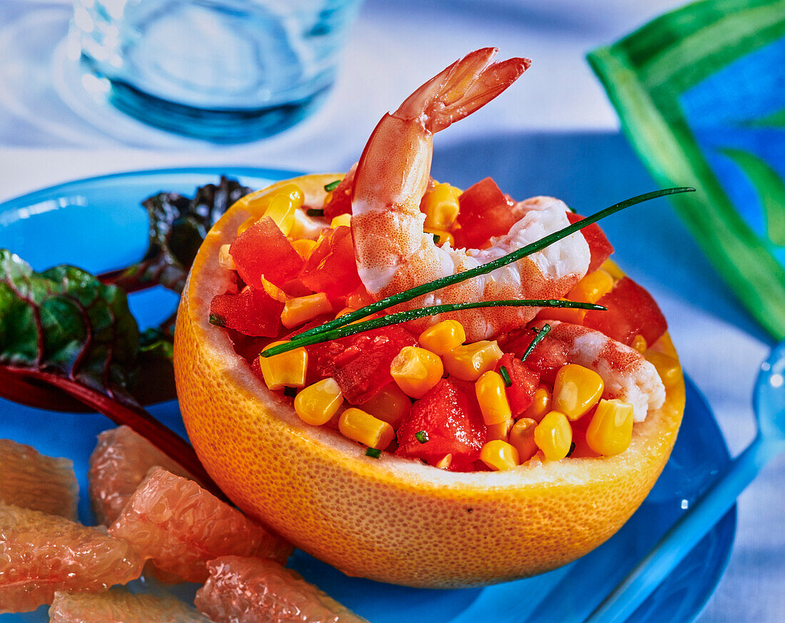 A stuffed grapefruit with sweetcorn, prawns and tomatoes
