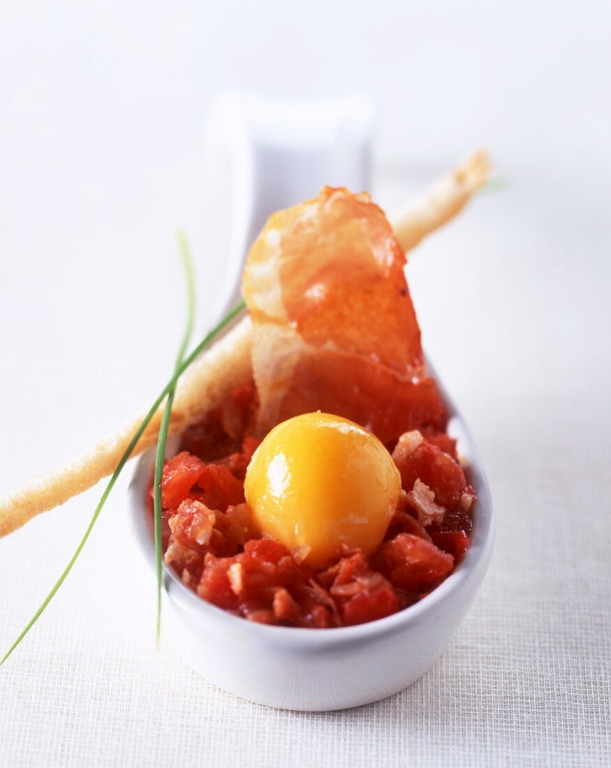 Tomato salsa with egg and raw ham