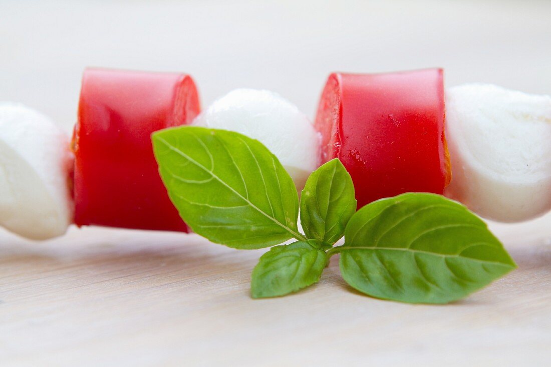 A tomato and mozzarella kebab with basil (detail)