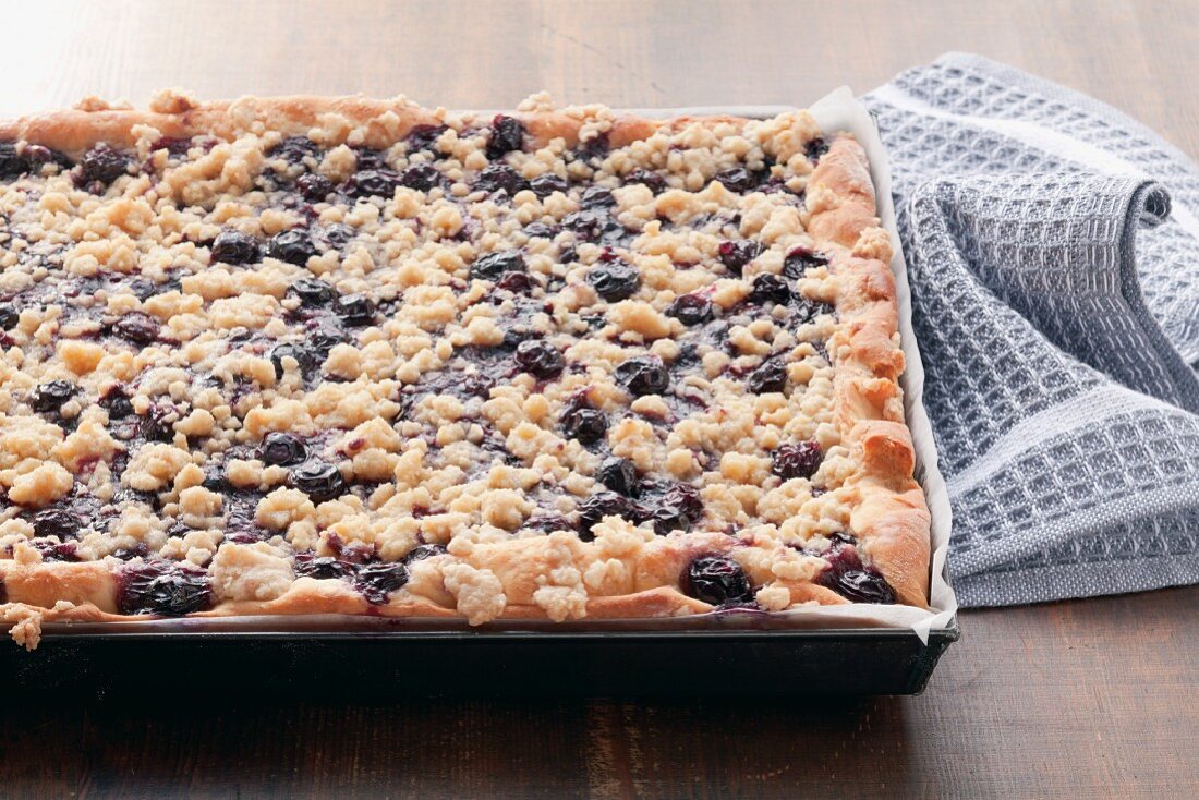 Blueberry crumble cake on a baking tray