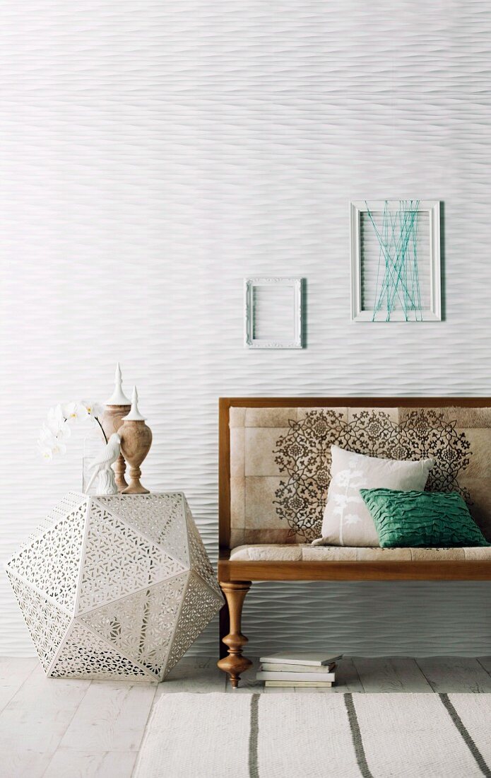 Wooden bench next to white floor lamp in Moroccan style