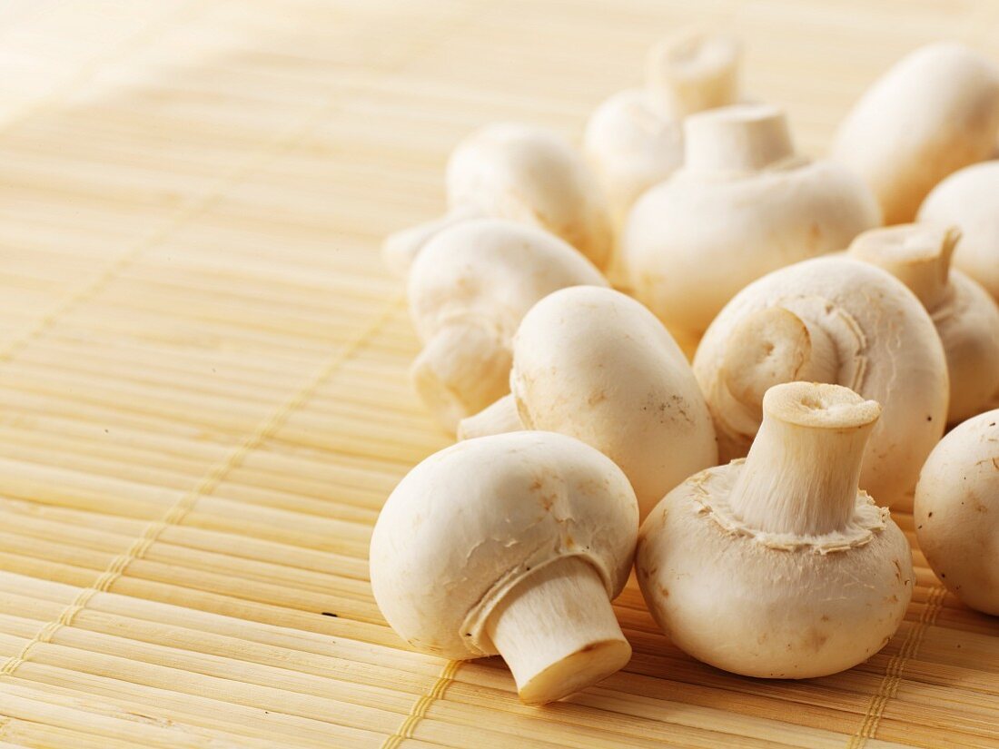Fresh mushrooms on a bamboo mat