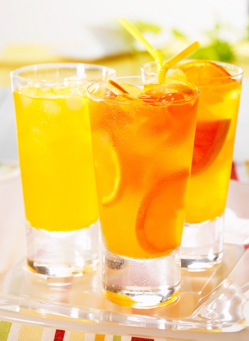 Three tangerine and grapefruit drinks