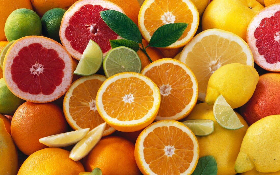 Citrus fruits, whole and halved