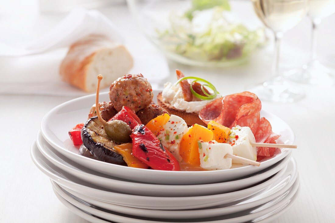 Kebabs, grilled vegetables and meatballs on a plate
