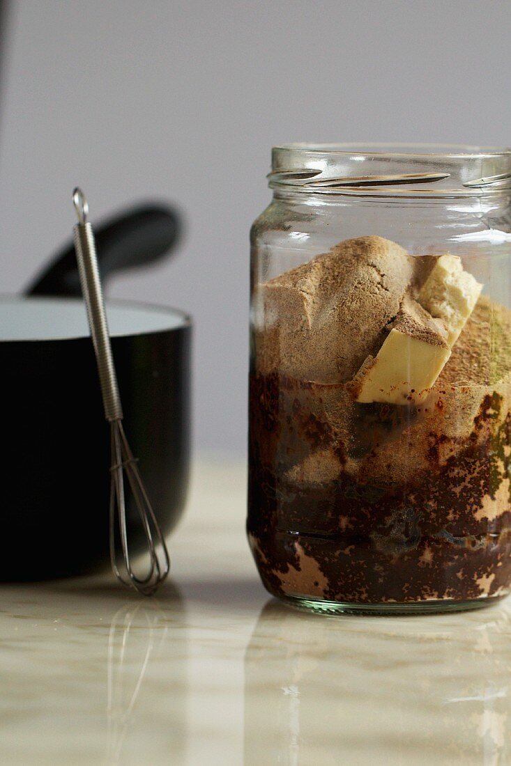 A jar of ingredients for vegan chocolate