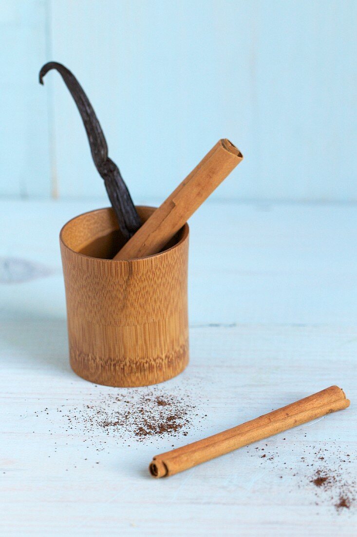 A vanilla pod and cinnamon sticks