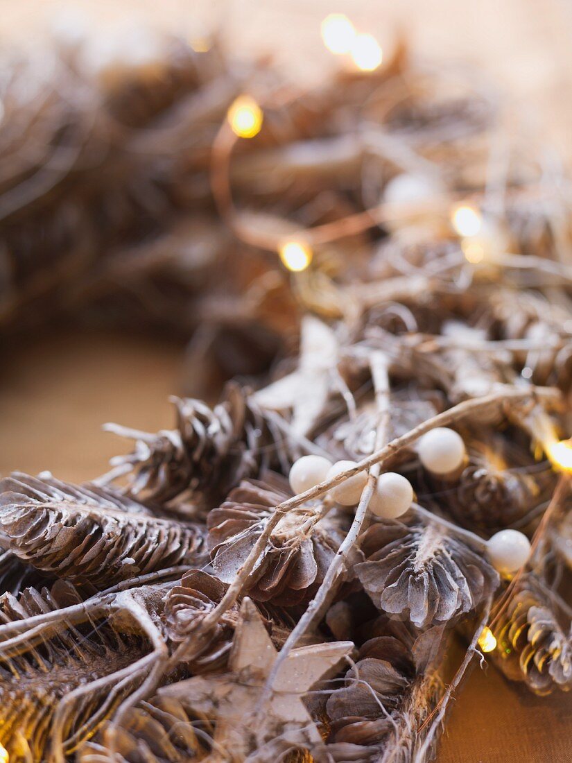 Advent wreath made from pine cones and snowberries