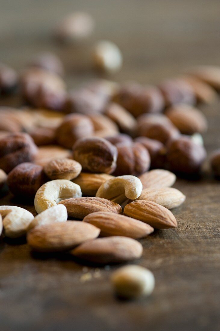 Mixed nuts on a wooden surface