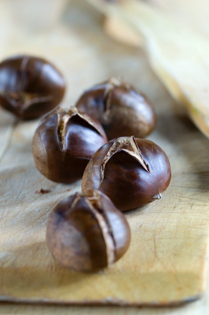Roasted chestnuts on a wooden board