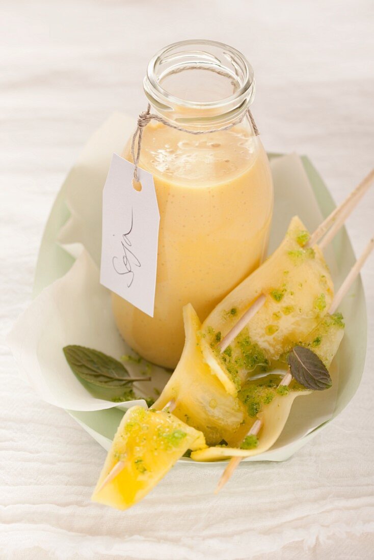 Mango soy milk lassi with pineapple sate and mint sugar