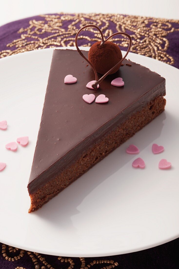 A slice of chocolate cake with a velvety truffle praline for Valentine's Day