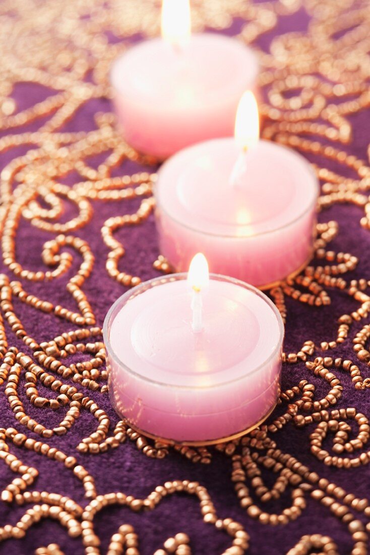 Pink tealights on luxury beaded tablecloth