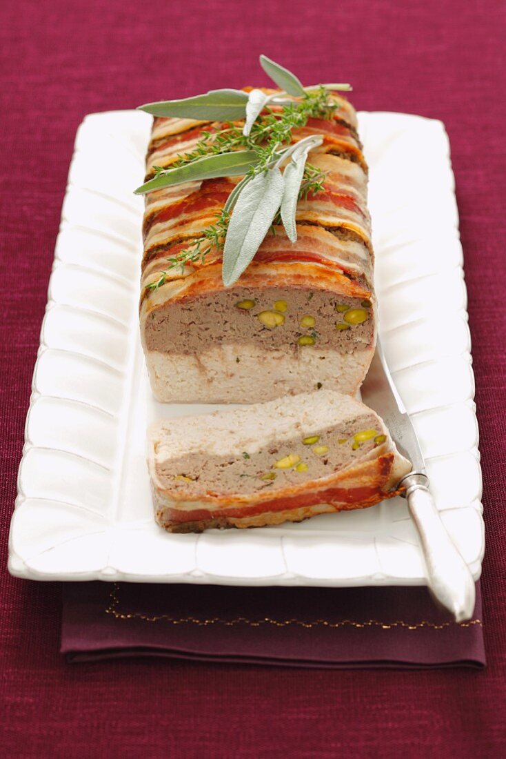 Chicken terrine with chicken liver wrapped in bacon