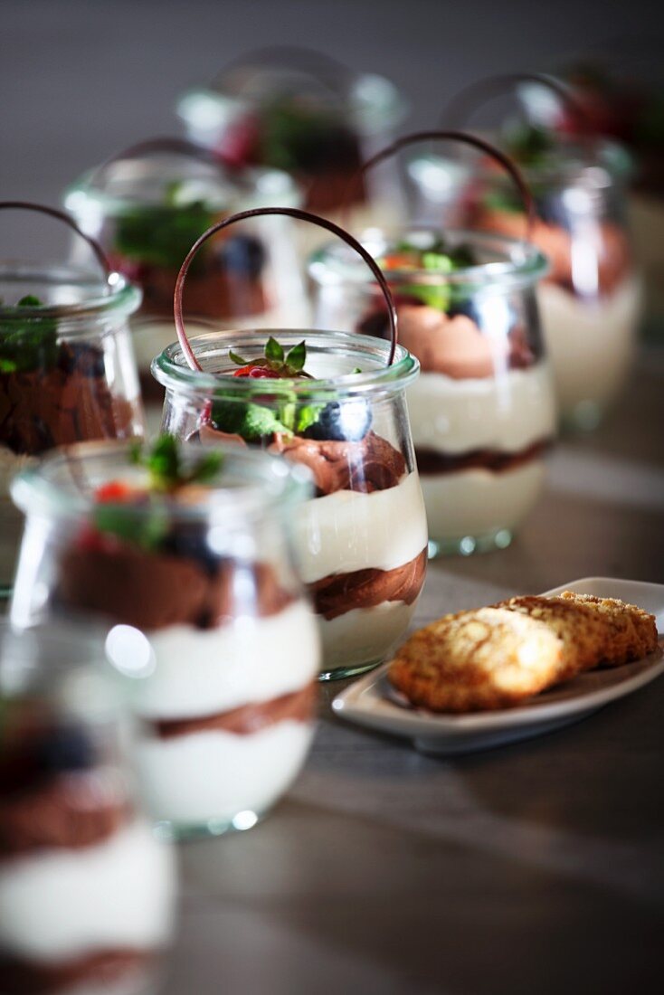 White and dark chocolate mousse in dessert glasses