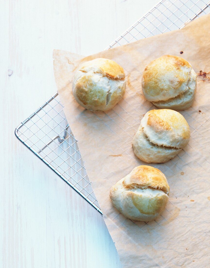 Scones on a piece of baking paper on a wire rack