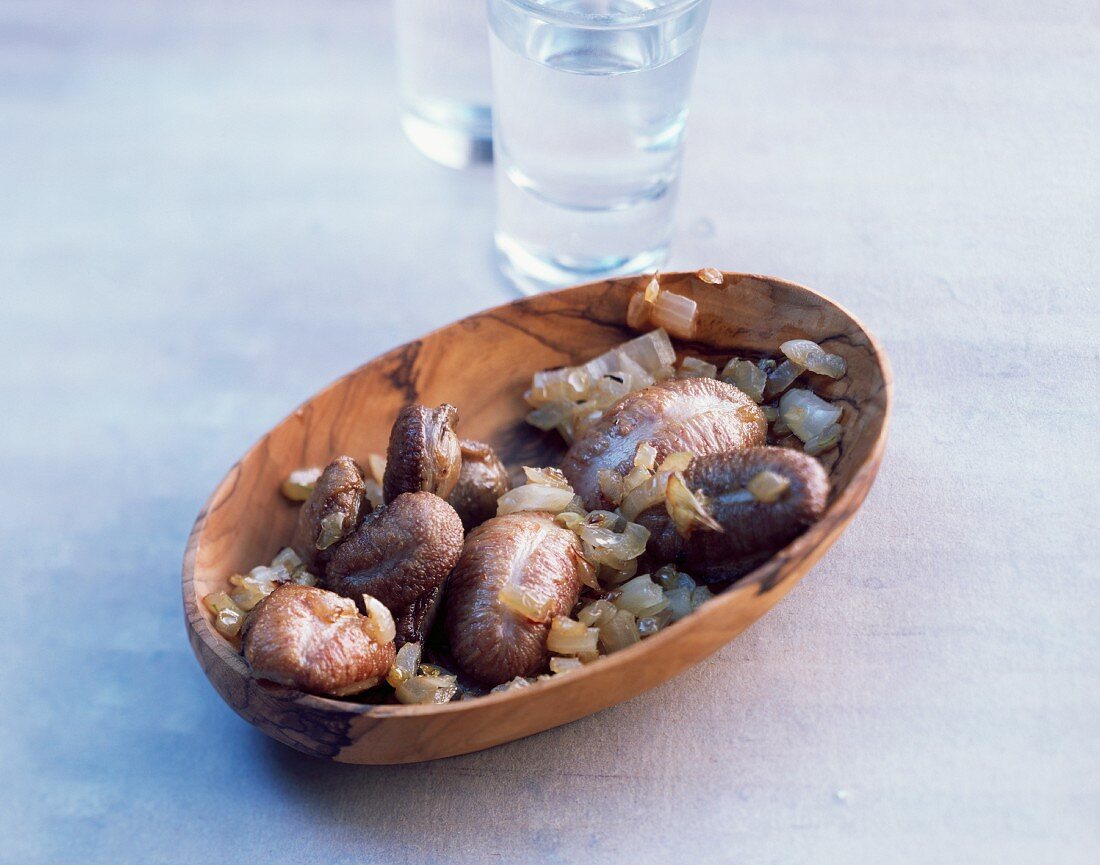 Piglets testicles with onions