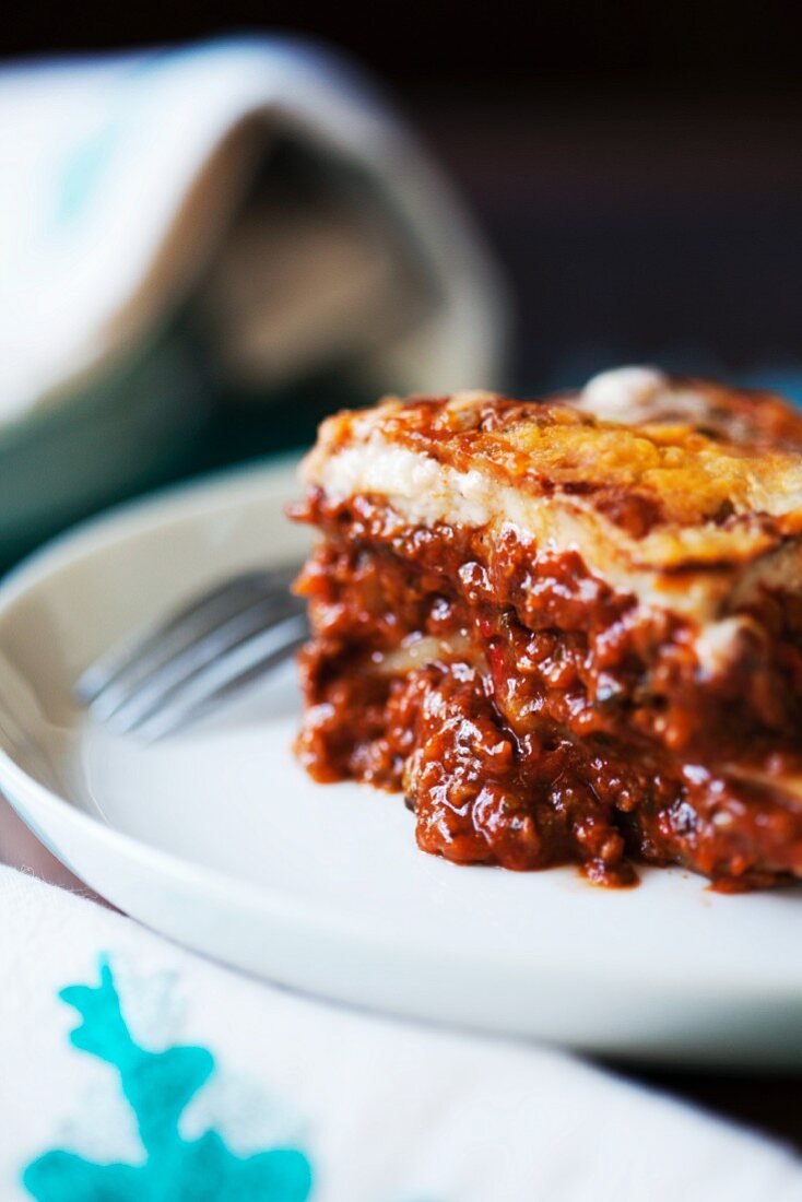 A slice of lasagne on a plate