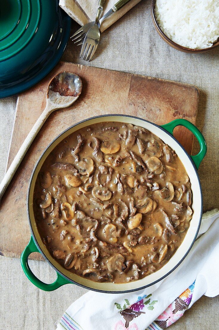 Beef stroganoff with mushrooms in a pot