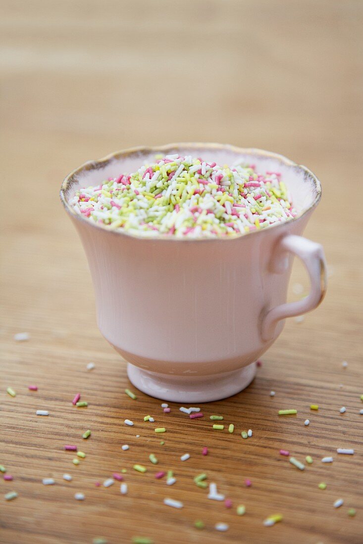 A cup of colourful sugar sprinkles