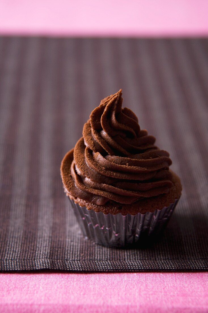 Chocolate Cupcake with Chocolate Frosting in a Foil Liner Cup