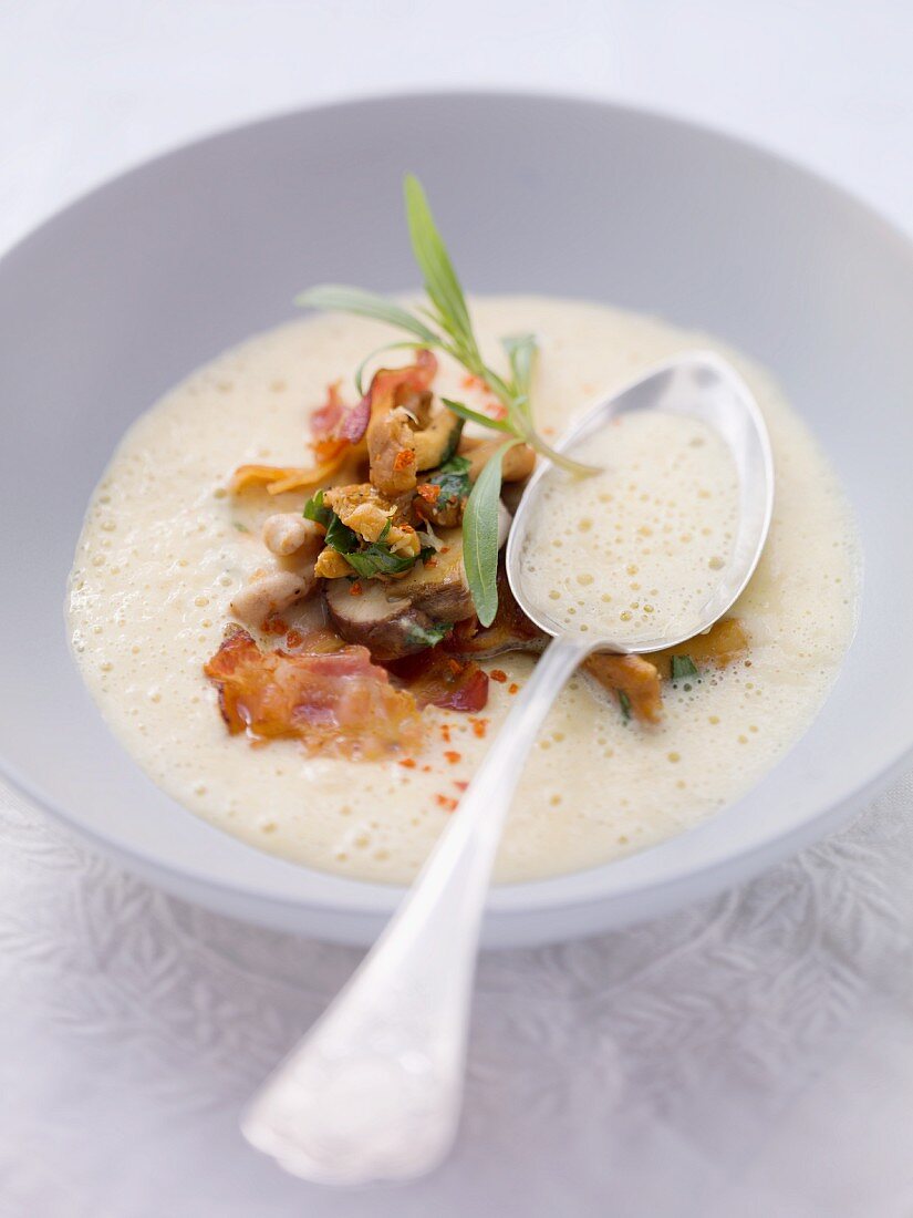 Cream of potato soup with fried mushrooms and bacon