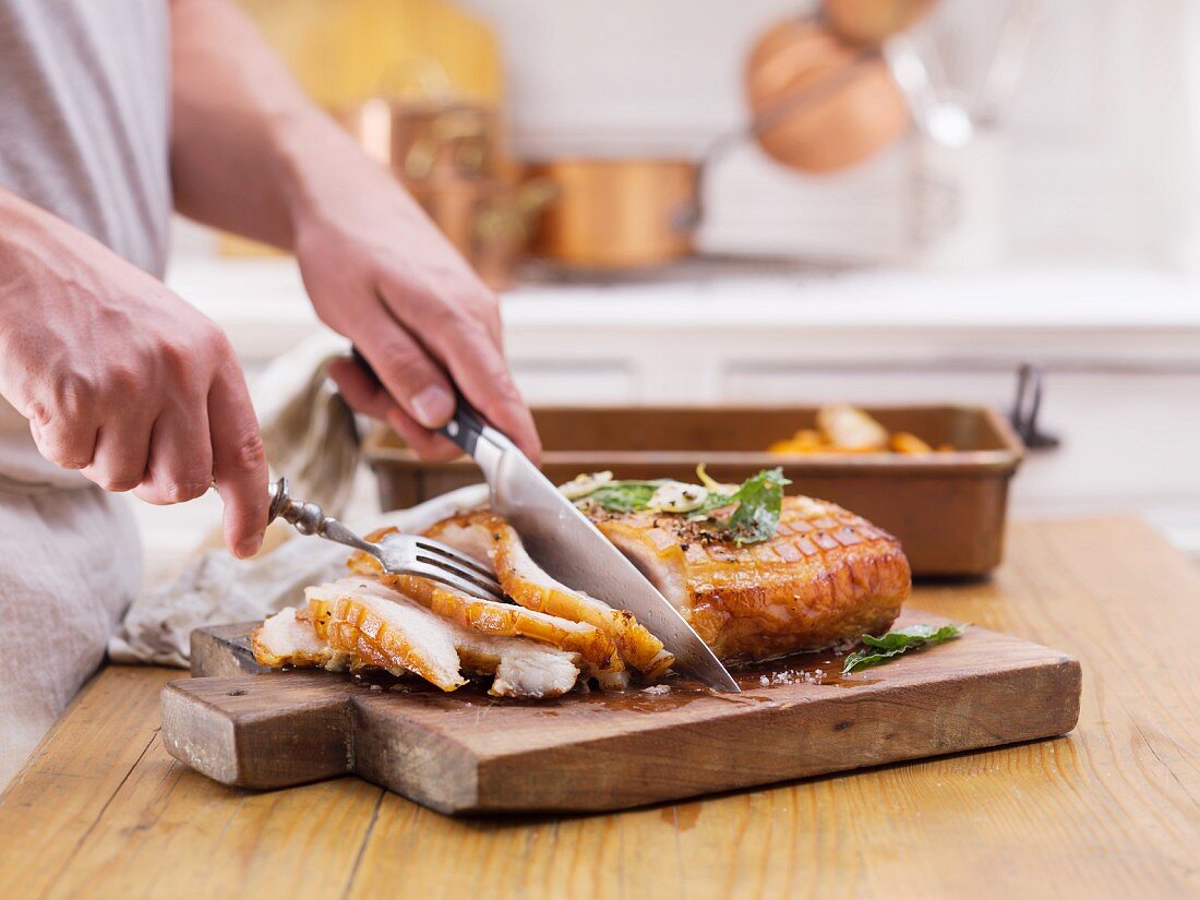 Crispy roast pork being sliced