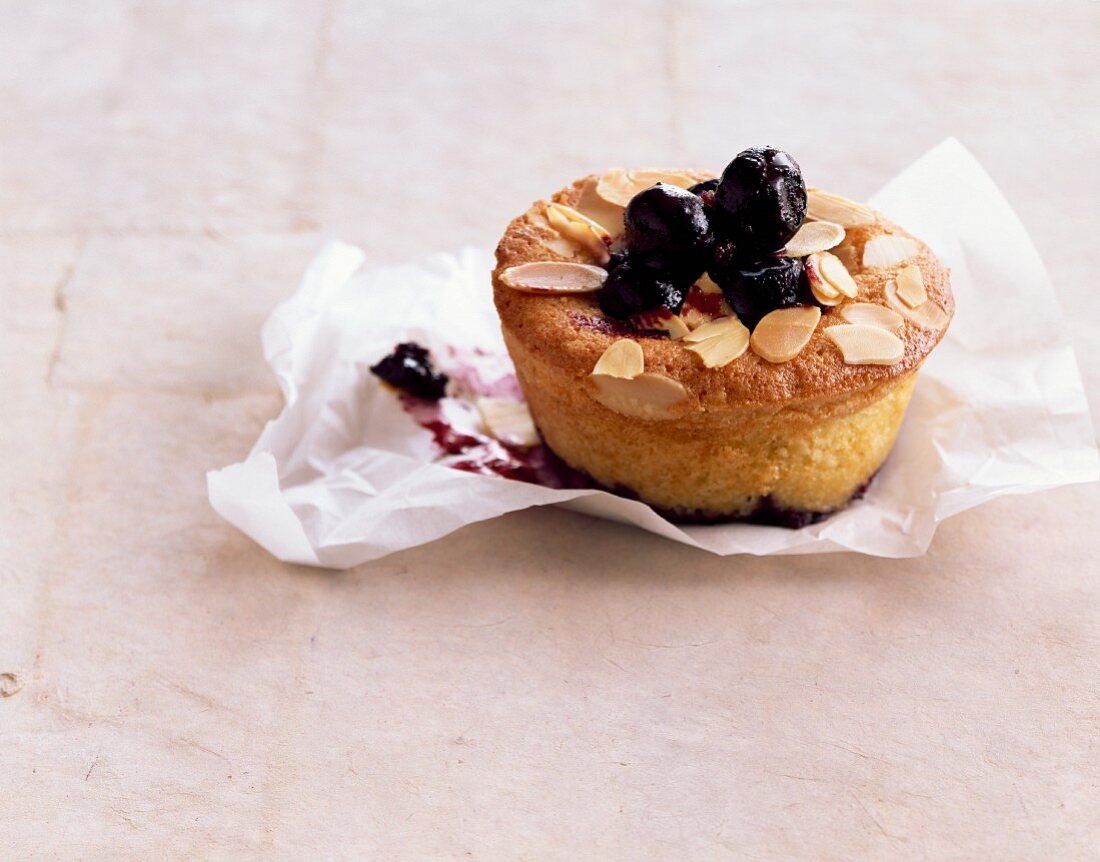 A blueberry muffin with lemongrass and slivered almonds
