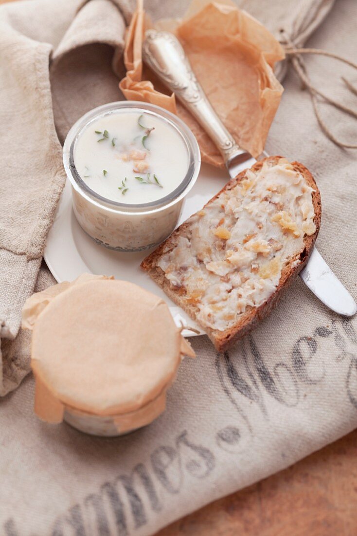 Homemade lard in jars and on slices of bread