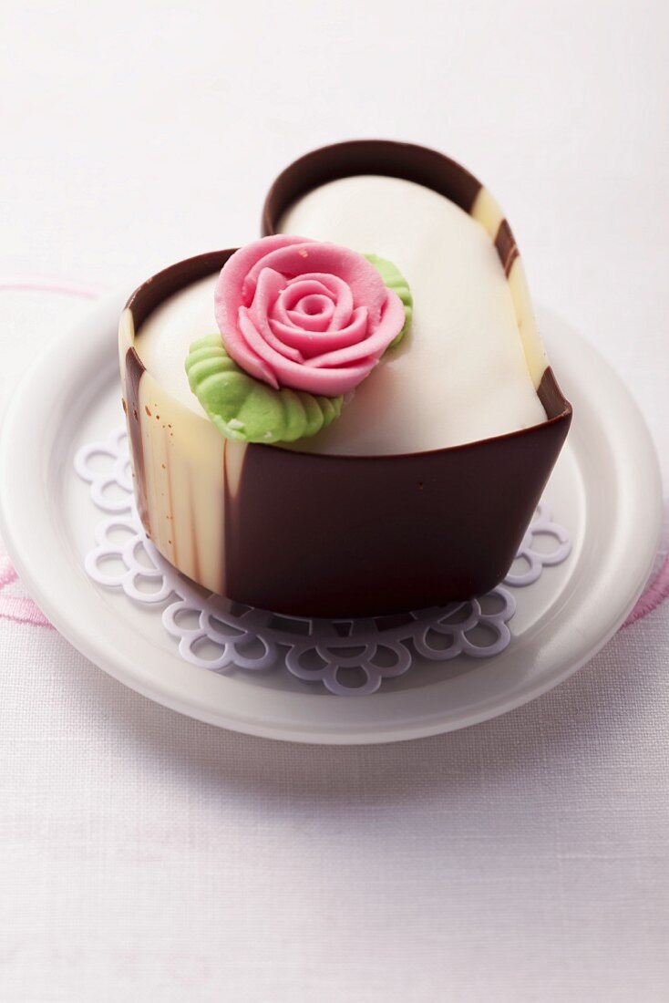 A heart-shaped praline decorated with a marzipan rose